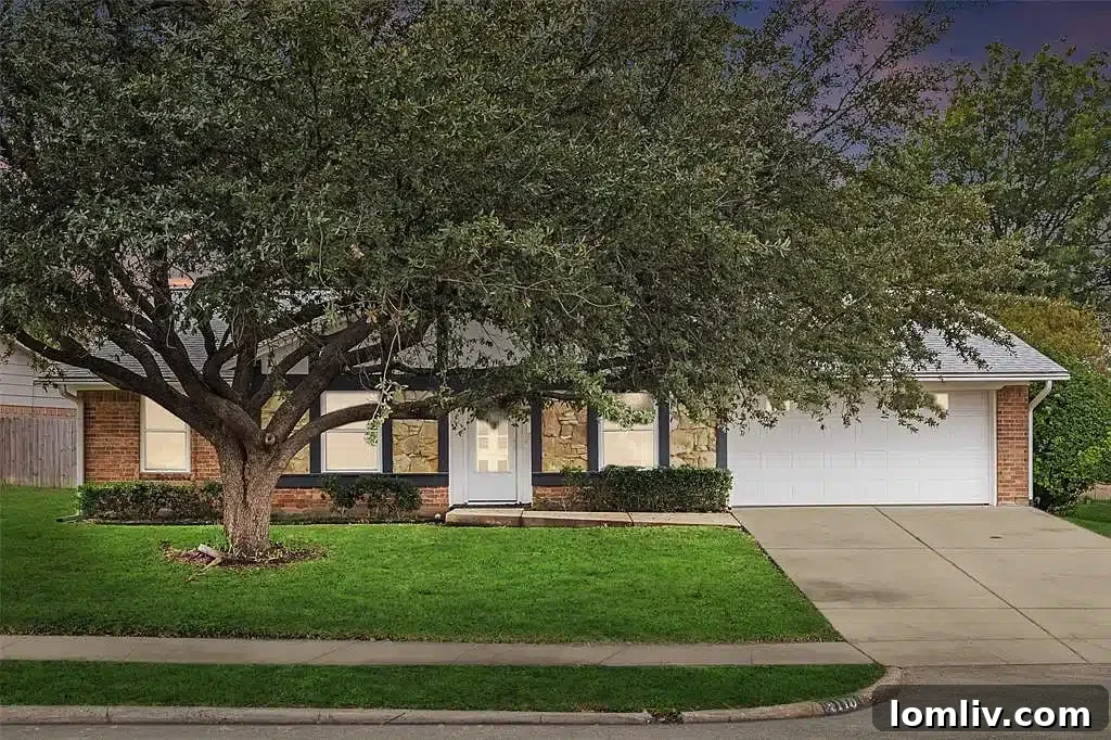 Spacious living room with vaulted ceilings and modern flooring in Carrollton home