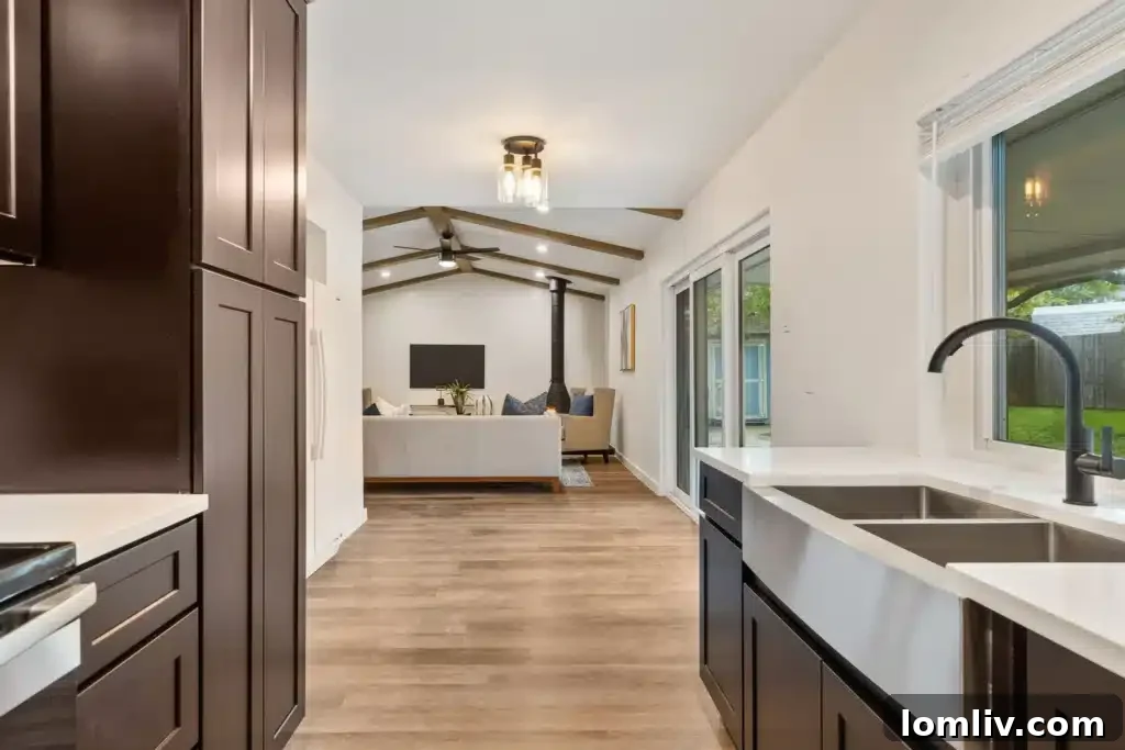 Stylish dining area flowing into the renovated kitchen