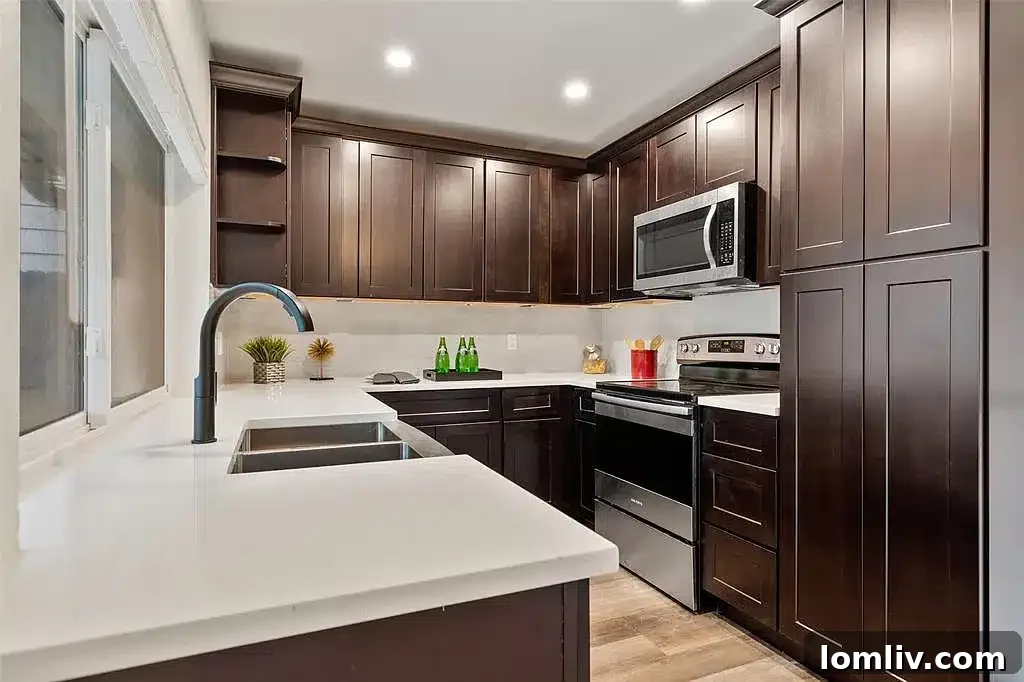 Modern kitchen with quartz countertops and stainless steel appliances
