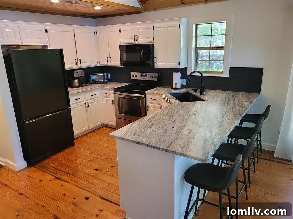 Bright and open kitchen with granite countertops and modern appliances