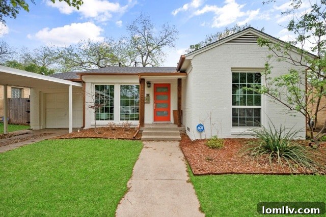 Elmwood neighborhood street view with a charming home and lush greenery