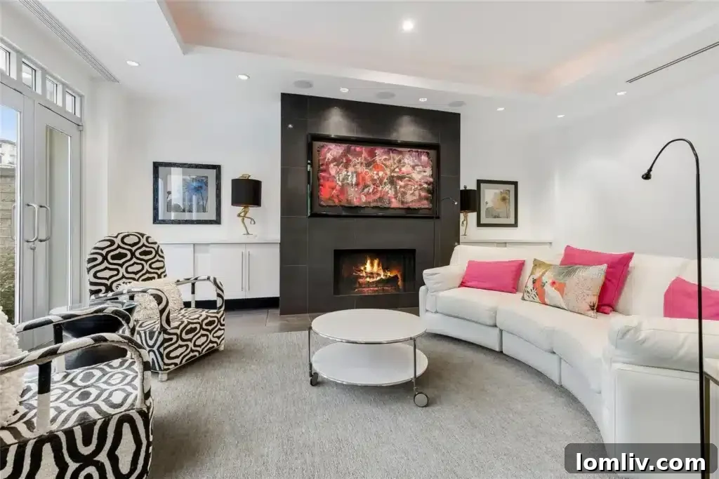 Bright and airy living space with minimalist design, large windows, and a sleek modern fireplace.