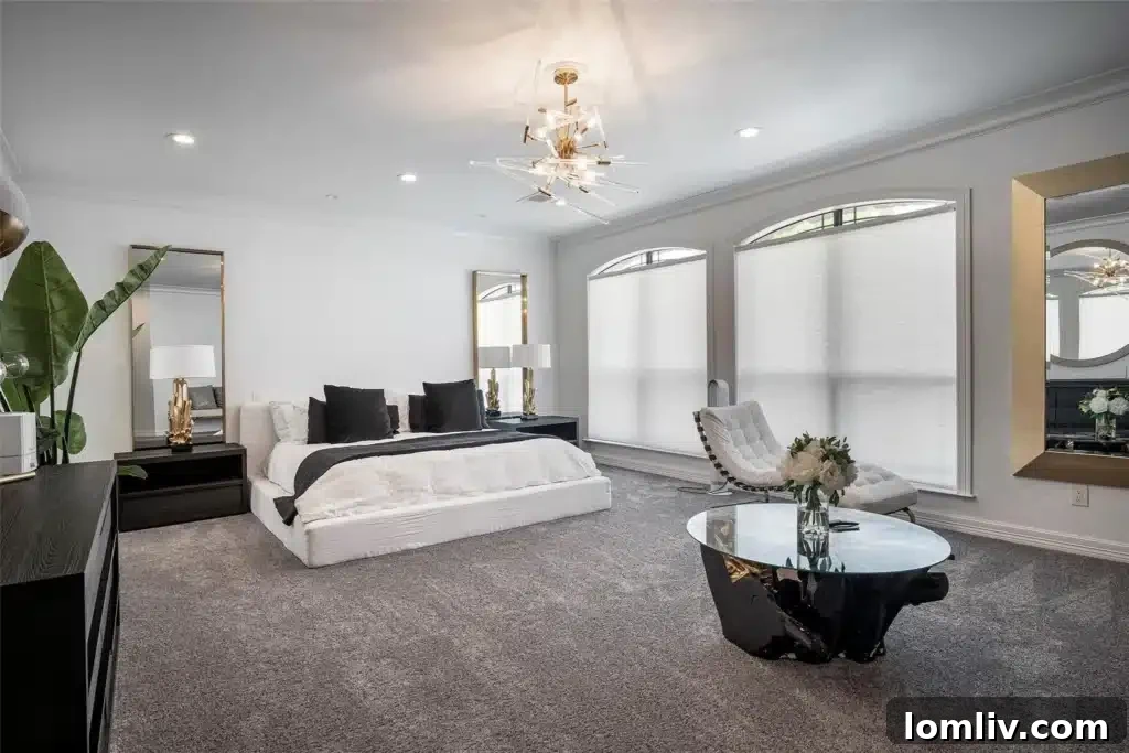 Renovated primary ensuite bathroom with marble-like tile flooring, a sparkling chandelier, and a spacious walk-in shower with multiple body sprays.