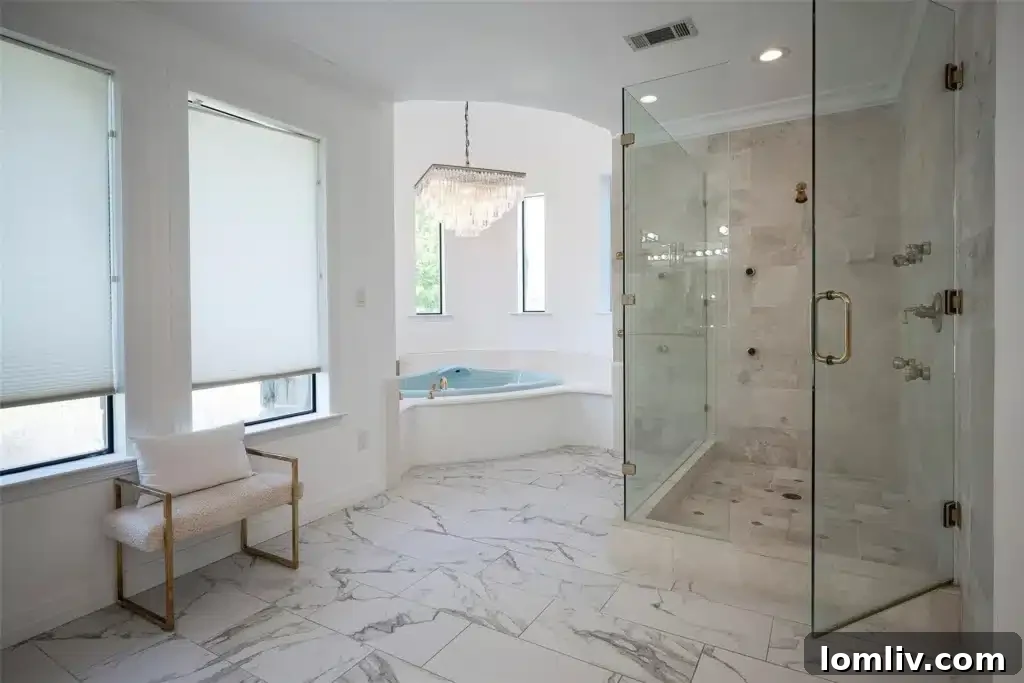Elegant dual vanity in the primary ensuite bathroom, featuring contemporary fixtures and ample counter space, reflecting the luxurious design.