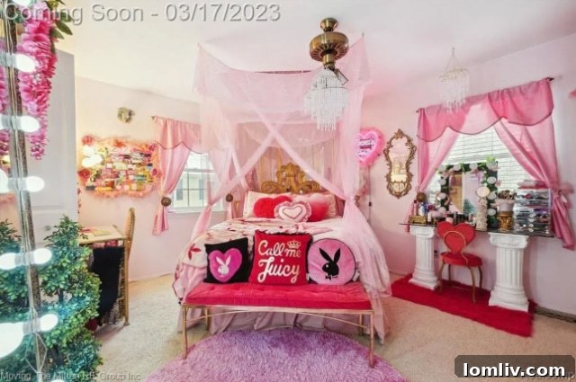 Bedroom entrance with a neon sign stating 'Call me Juicy' in a pink-themed room