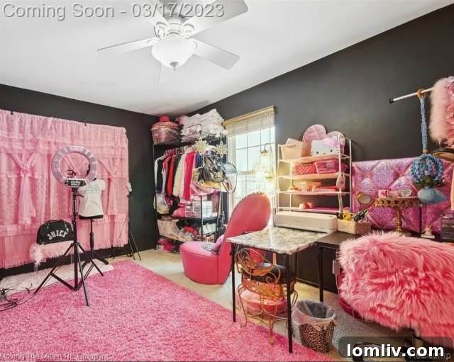 Second bedroom with eclectic decor, possibly still pink-inspired with unique wall art