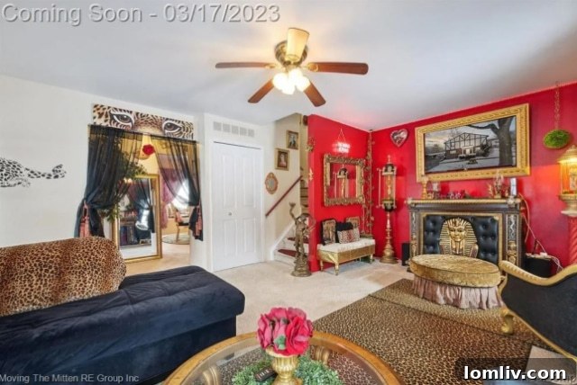 Detailed view of the leopard print accent wall and sofa in the Michigan condo living room
