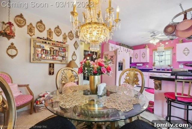 Elegant chandelier dominating a compact dining area with unique decor
