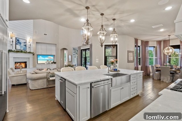 Elegant kitchen island with Carrara marble countertops and farmhouse sink
