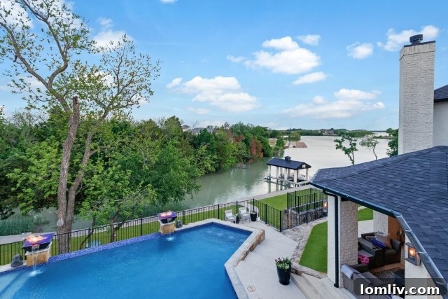 Heated infinity pool overlooking Lake Ray Hubbard with fire bowls and swim-up seating