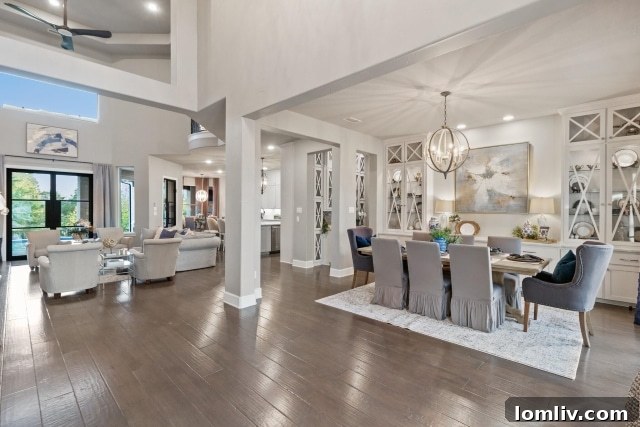 Spacious living room with high ceilings and fireplace in the luxury Heath Golf and Yacht Club home