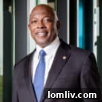 Portrait of Councilman Tennell Atkins, smiling confidently.