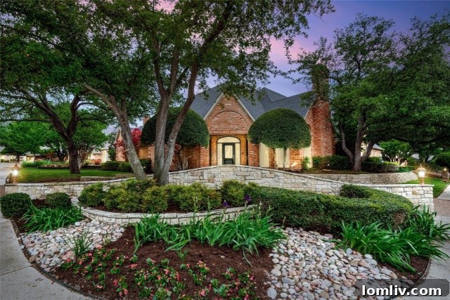 Stunning exterior view of a luxury home in Prestonwood West, Dallas, featuring a circular driveway and sophisticated landscaping.