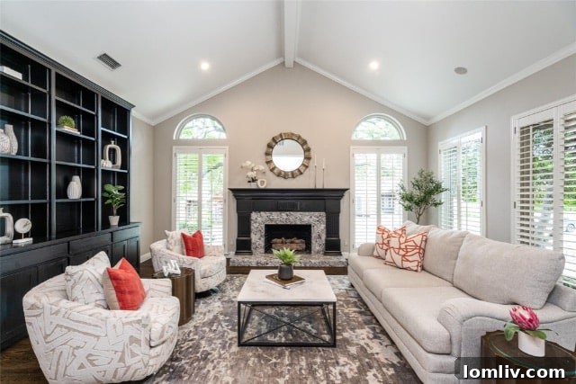 Elegant front entrance of a Dallas luxury home with a circular driveway and mature trees.
