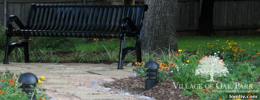 A serene street view in The Village of Oak Park, showcasing well-maintained homes and a clean, inviting environment.