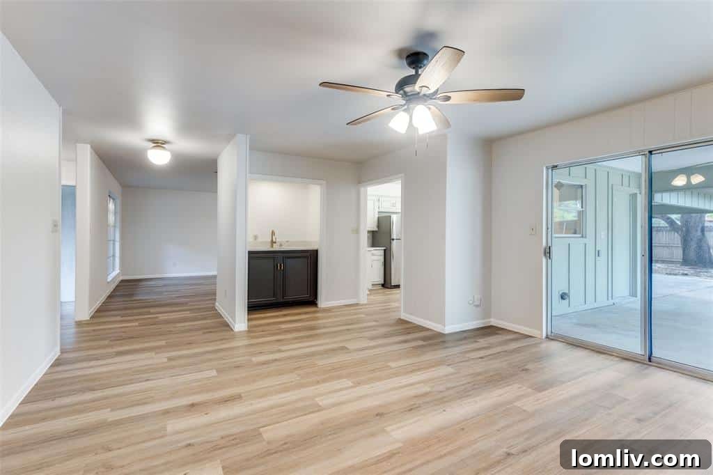 Spacious and bright living area in one of the Fort Worth duplexes, showcasing modern finishes and an open concept.