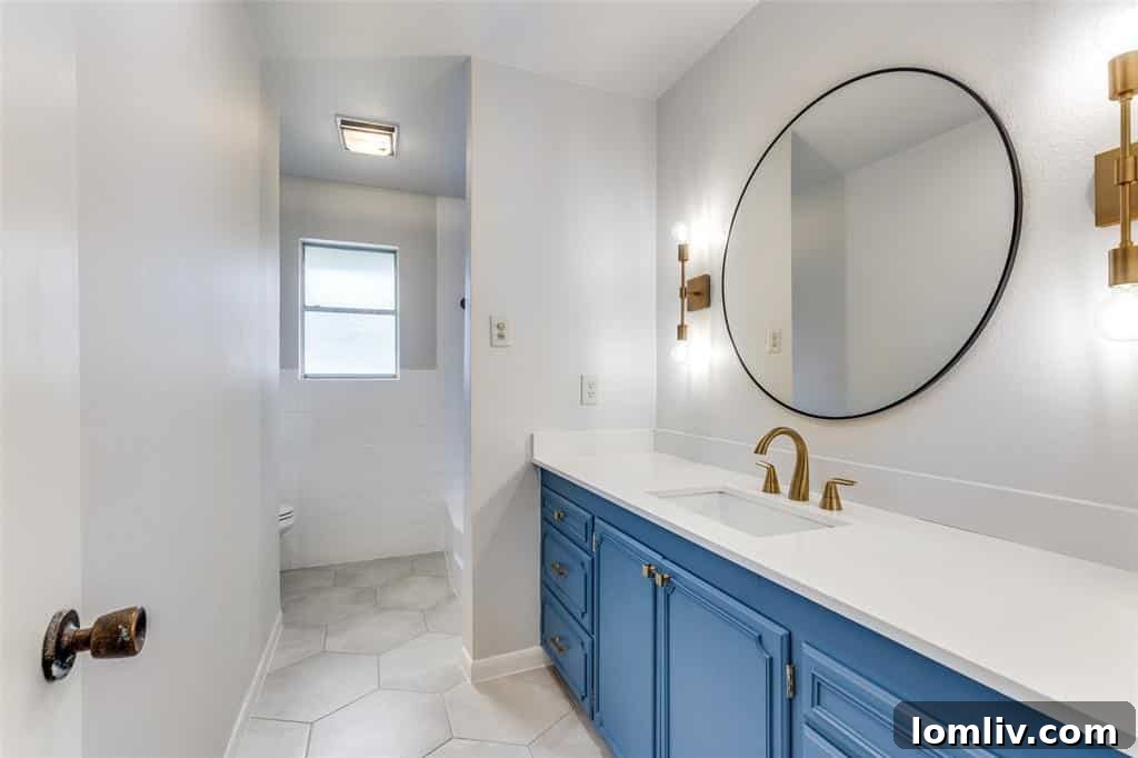 Modern bathroom with elegant fixtures and fresh updates in a Fort Worth duplex.