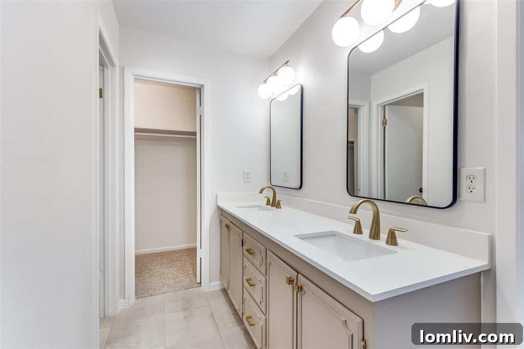 Stylish bathroom vanity and mirror in one of the Fort Worth duplex units, reflecting modern design.