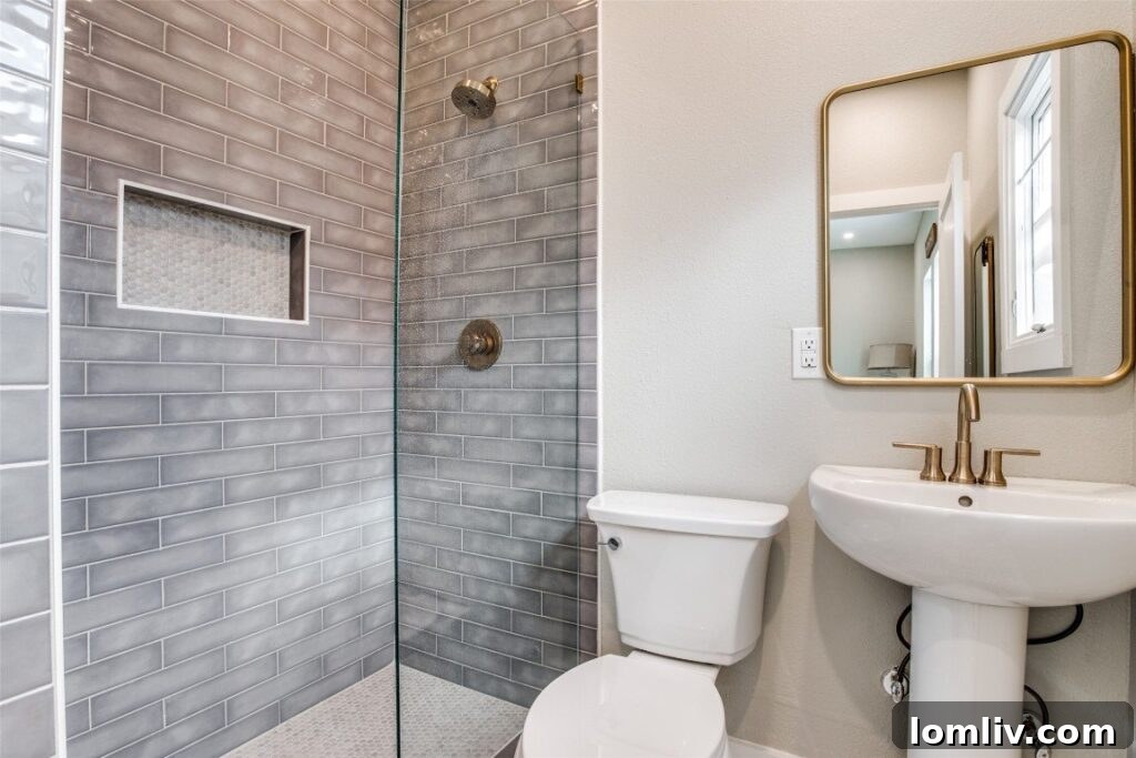 Chic Primary Bathroom - Gray Subway Tile and Brushed Brass