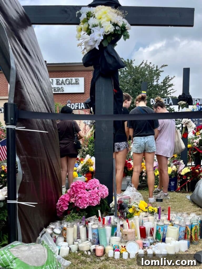 Votive candles honor the victims.