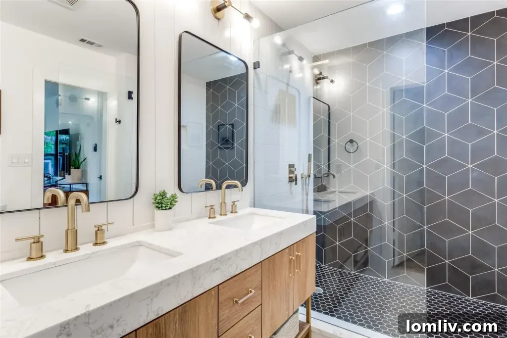 Luxurious primary bathroom with walk-in shower and dual vanities