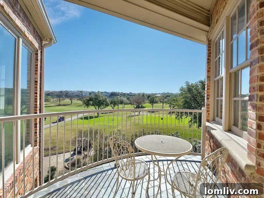 Luxurious entry foyer of a grand traditional home with high ceilings, a sweeping staircase, and elegant chandeliers.