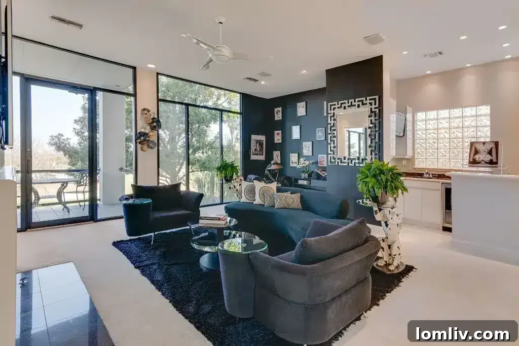 Spacious dining area adjacent to the kitchen, featuring modern light fixtures and ample natural light.