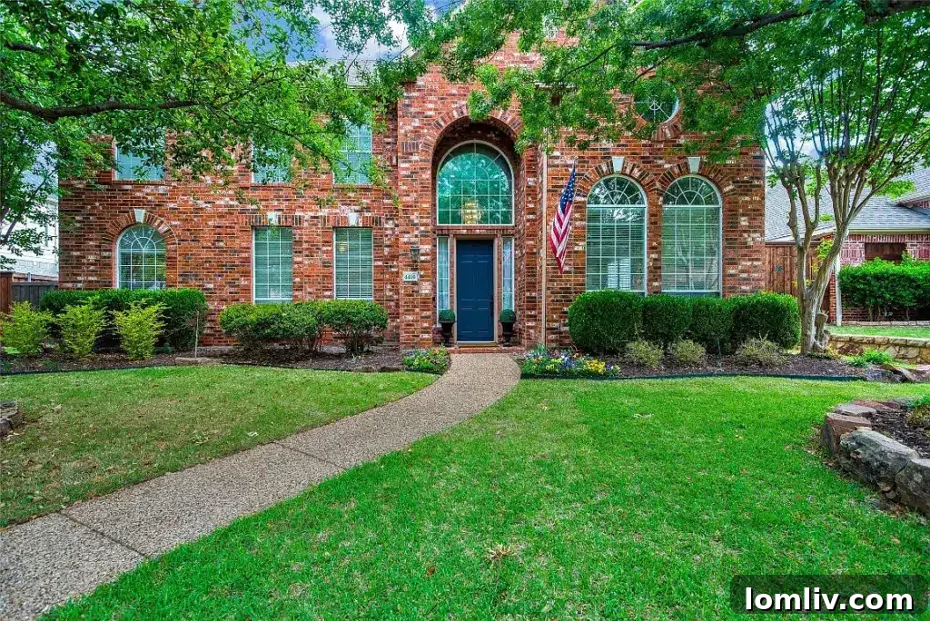 Elegant two-story red brick house at 4416 Mira Vista Drive, Frisco, with a welcoming exterior and well-maintained landscaping, ideal for entertaining families.