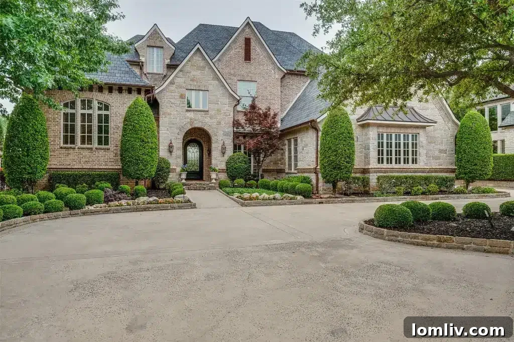 Close-up of the elegant pool area at 5204 Pool Road, Colleyville, highlighting natural stone finishes and mature greenery, true to its name and location.