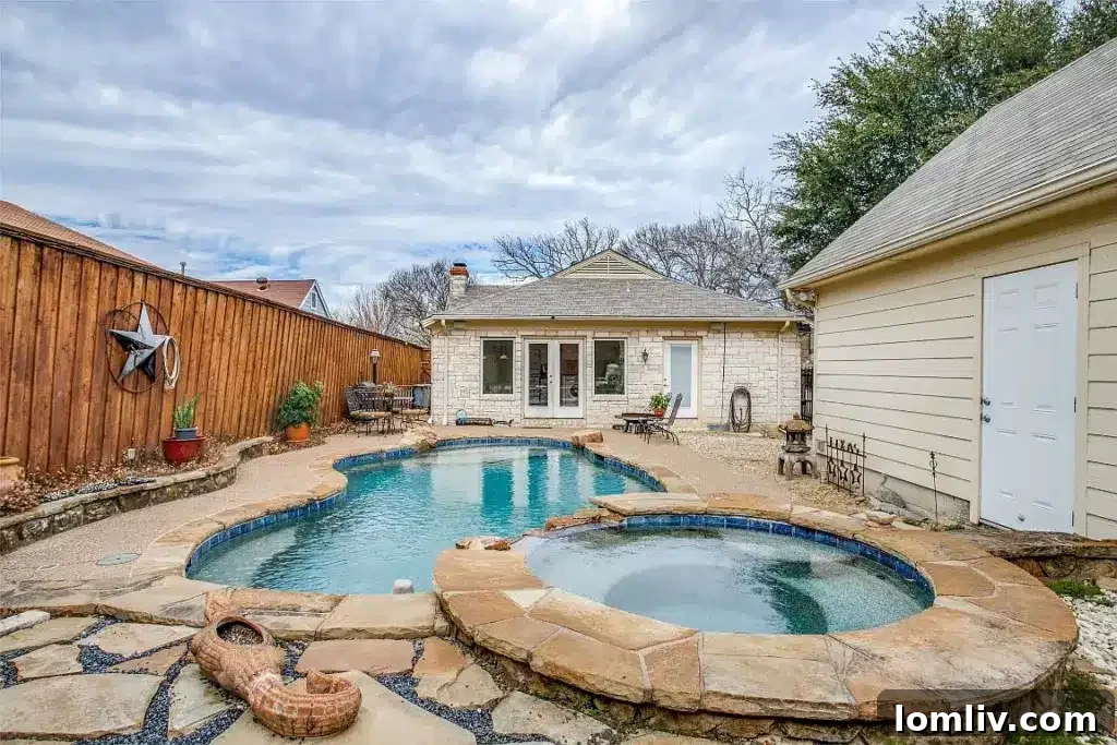 Charming 1939 two-bedroom Dallas home at 2610 Marvin Avenue, featuring classic architectural details, inviting curb appeal, and a refreshing backyard pool.
