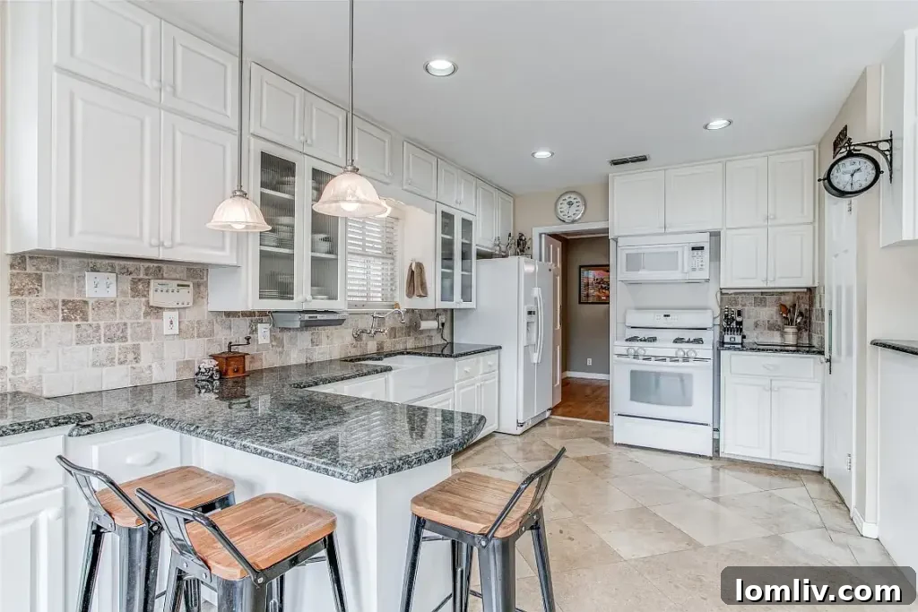 Tastefully updated kitchen in the 1939 Dallas home, blending modern amenities with classic design elements, perfect for contemporary living.