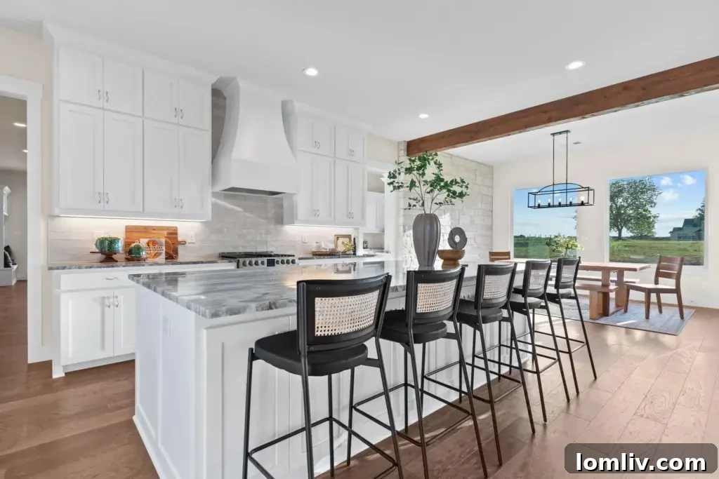 A gourmet kitchen with a large island, high-end appliances, and elegant wood beam accents.