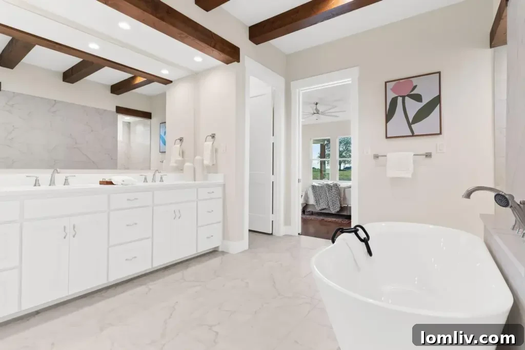A luxurious owner's bathroom with a spacious walk-through shower and a large soaking tub, designed for relaxation and accessibility.