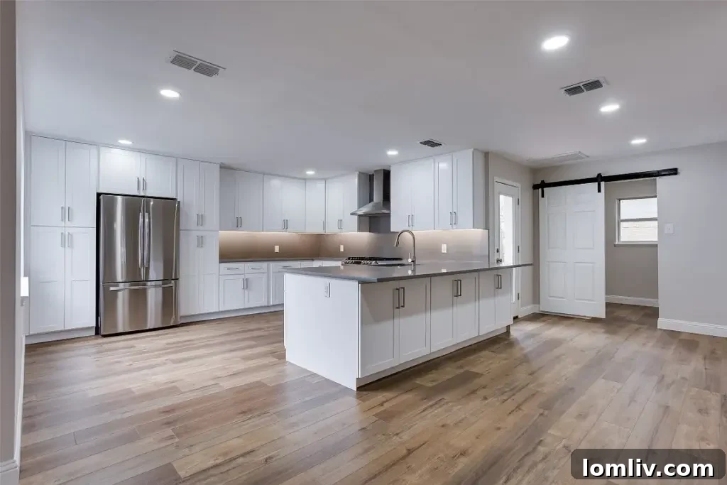 Bright and spacious living room at 8740 Charing Cross Lane with luxury flooring and large windows.