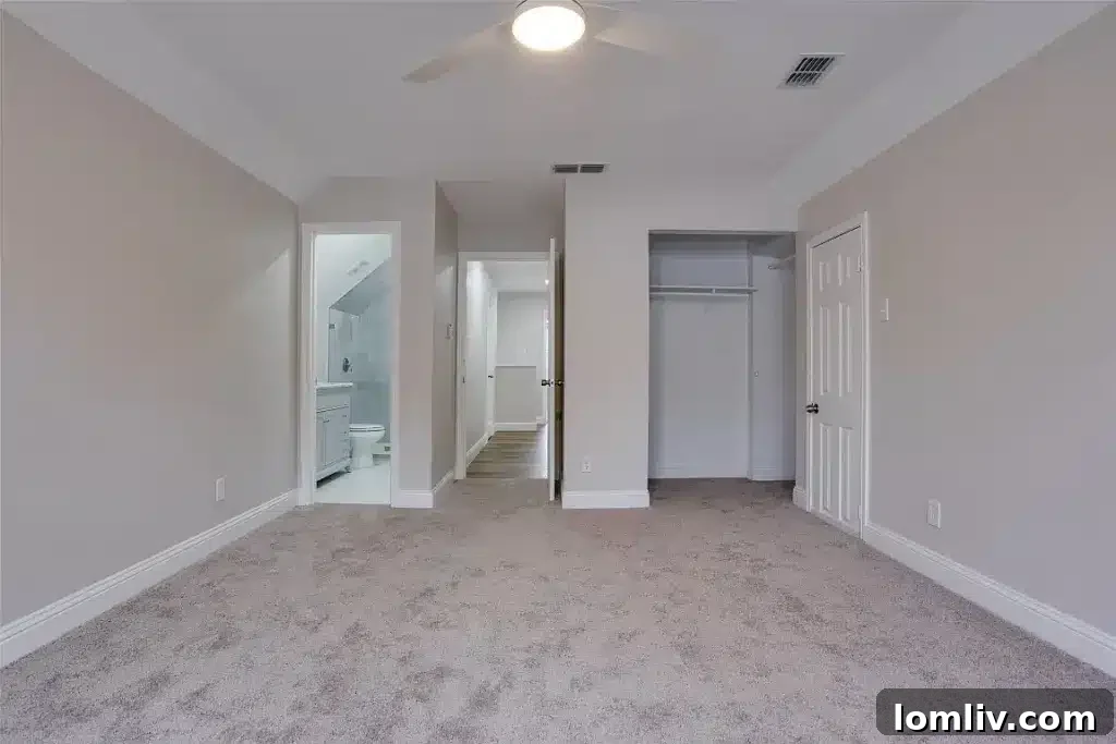 Luxurious bathroom with modern vanity and elegant tiling at 8740 Charing Cross Lane.