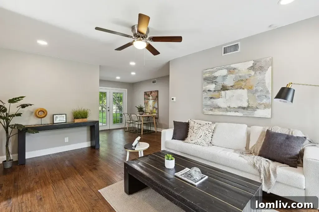 Exterior view of a stylish three-bedroom bungalow at 10307 Desdemona Drive in East Dallas, showcasing its modern curb appeal after recent upgrades.