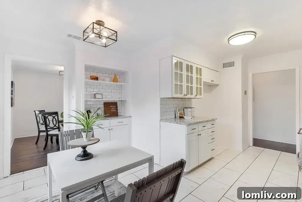 Bright and airy living room at 9740 Ash Creek Drive, highlighting the blend of classic and contemporary styles.