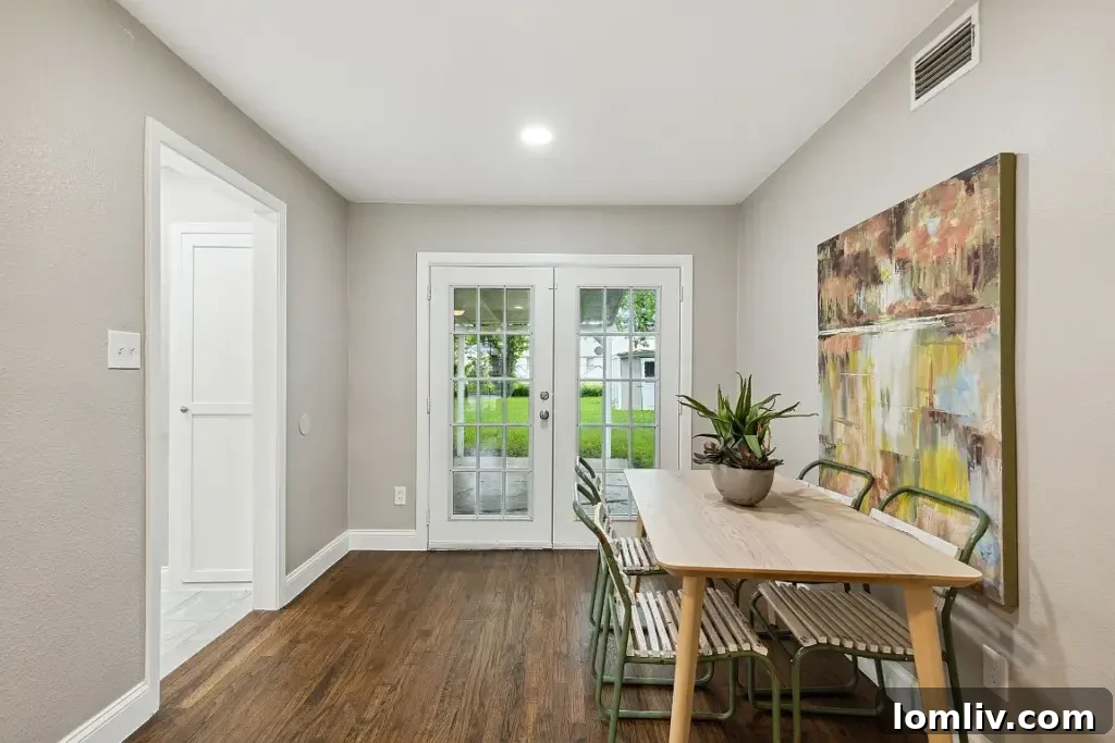 Another view of the living space highlighting the natural light and seamless flow.