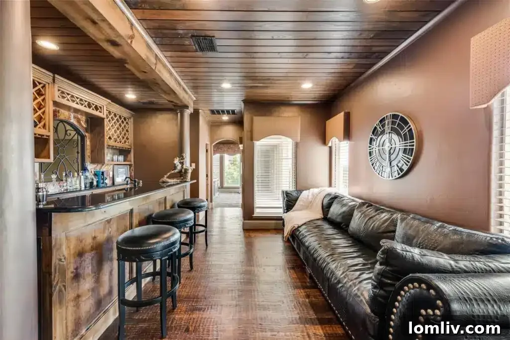 Spacious living area featuring two full bars, indicating a home designed for entertaining guests.