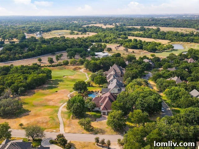 The stunning Split Rail Estates home, perfectly situated by the 11th tee box of Split Rail Golf Course, offering panoramic views of the fairway.