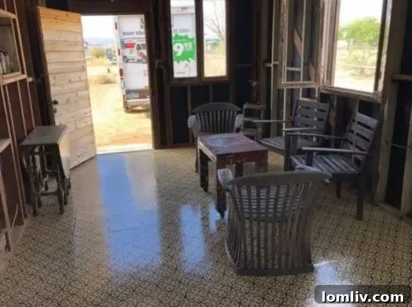 Another view of the mobile home's interior, highlighting its fixer-upper status and creative potential.