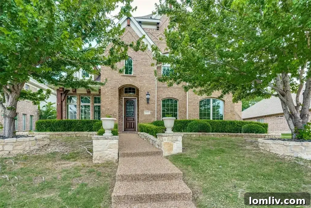 Elegant Wylie home with stunning resort-style backyard, pristine swimming pool, and lush landscaping