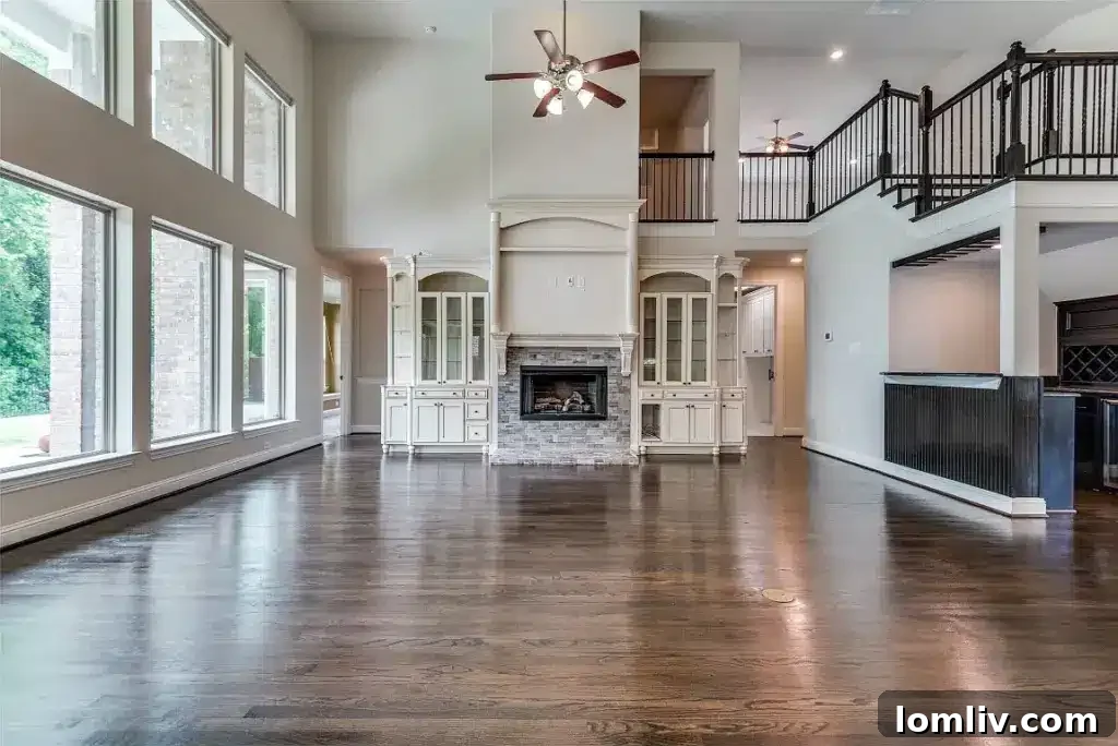 Renovated kitchen with professional gas range, quartz counters, and custom maple cabinets in Wylie home