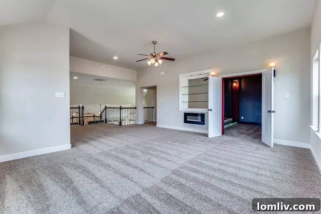Resort-style backyard with pristine swimming pool, expansive patio, and lush landscaping in Wylie