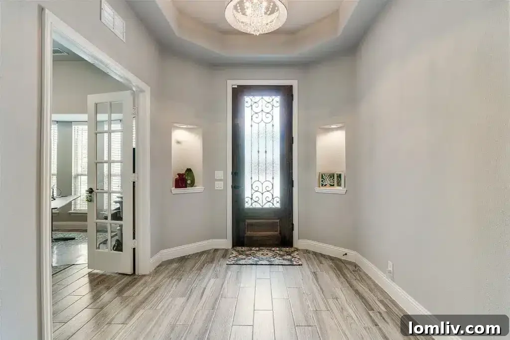 Bright and airy open concept living room and kitchen in Wylie home, ideal for entertaining