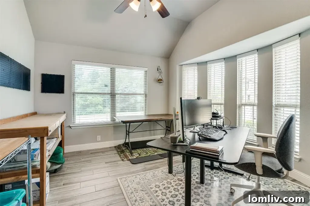 Modern kitchen with breakfast bar, stainless steel appliances, and ample counter space overlooking living area