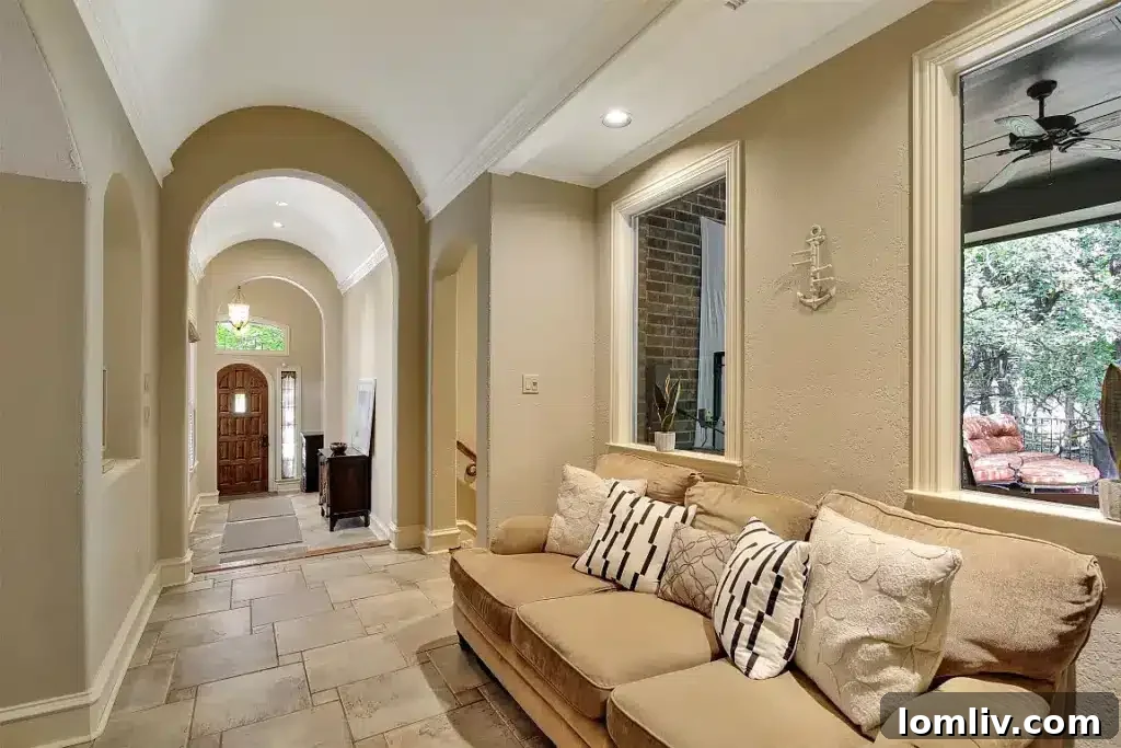 Modern kitchen with large island, high-end appliances, and ample natural light in a Wylie luxury home