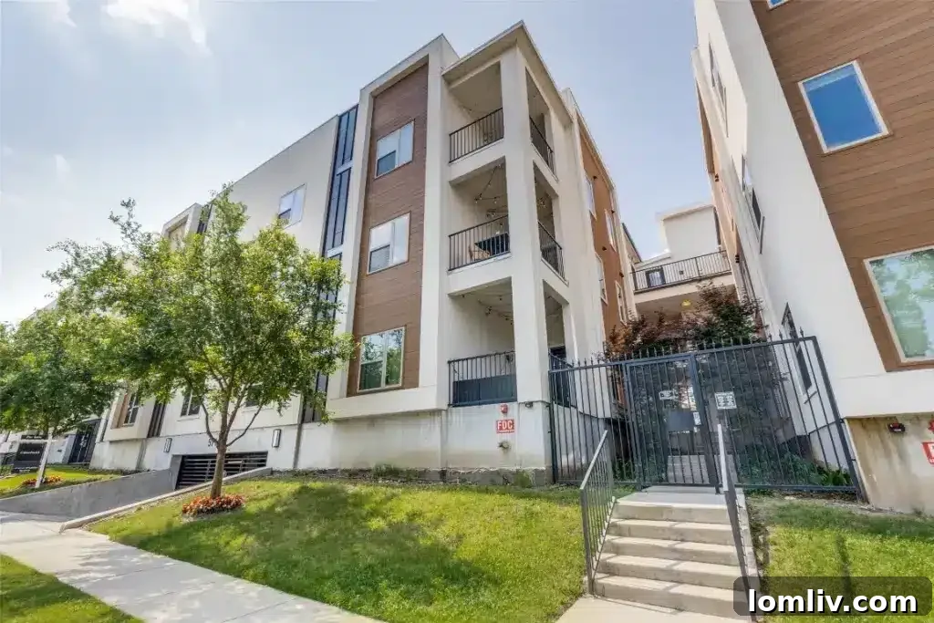 Elegant M Streets Dallas condo exterior, featuring modern architecture, a stylish entrance, and manicured landscaping.