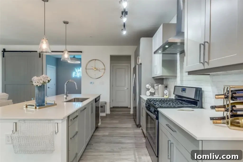 Spacious and elegant primary bedroom in the M Streets Dallas condo, featuring city views, a tranquil color palette, and ample natural light.