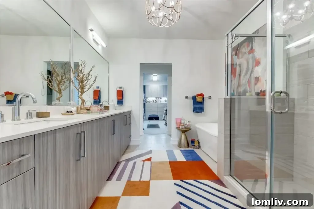 Stylish walk-in shower with modern tiling and frameless glass enclosure in the primary ensuite bathroom.